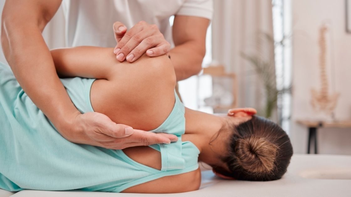 A doctor performing a spinal manipulation