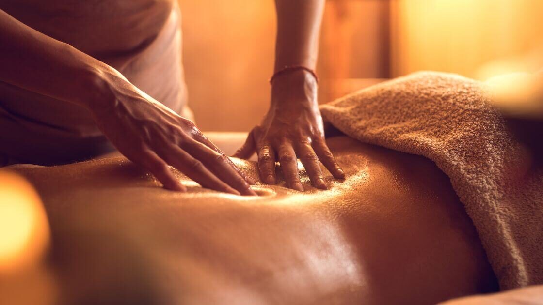 A massage therapist performing lymphatic drainage massage on a patient compared to other massage therapies